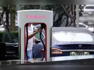 Tesla again cuts EV prices in US.