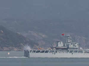 A Chinese warship fires towards the shore during a military drill near Fuzhou near the Taiwan controlled Matsu Islands
