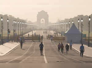 New Delhi: Youngsters jog at the Kartavya Path, near India Gate in New Delhi. (P...
