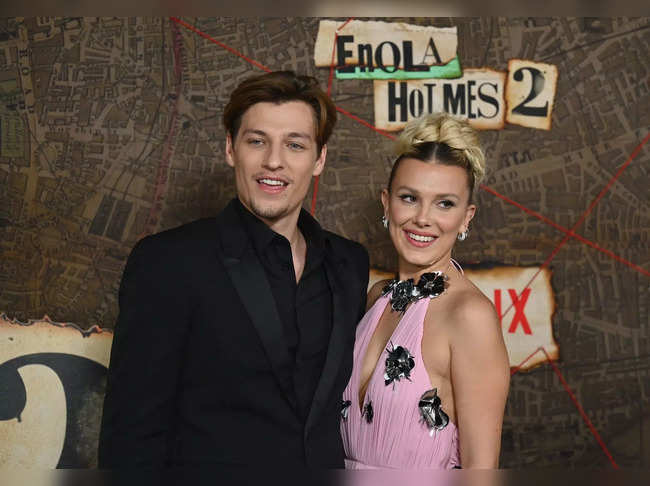 (FILES) In this file photo taken on October 27, 2022 Jake Bongiovi (L) and British actress Millie Bobby Brown arrive for the premiere of Netflix's "Enola Holmes 2" at The Paris Theatre in New York City. "Stranger Things" star Millie Bobby Brown is to marry her long-term boyfriend Jake Bongiovi, she has announced April 11, 2023. (Photo by ANGELA WEISS / AFP)