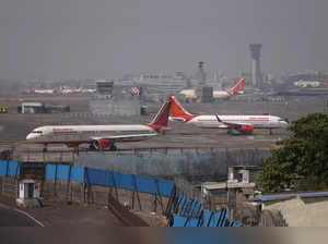 Air India passenger aircraft are seen on the tarmac at Chhatrapati Shivaji International airport in Mumbai