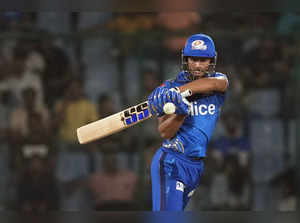 New Delhi: Mumbai Indians batter Tilak Varma plays a shot during the IPL 2023 cr...