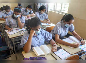 Gurugram: Students, wearing face masks as a precautionary measure amid rising ca...