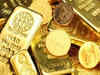 Gold edges up on weaker dollar, bets of Fed pause