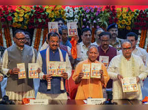 Lucknow: Uttar Pradesh Chief Minister Yogi Adityanath with Deputy Chief Minister...