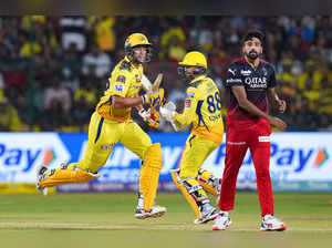 Bengaluru: Chennai Super Kings batters Devon Conway and Shivam Dube run between ...