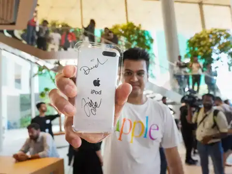 ​A man shows an iPod