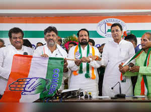 Bengaluru: Congress Karnataka President DK Shivakumar gives the party flag to fo...