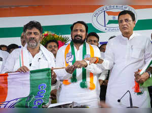 Bengaluru: Congress Karnataka President DK Shivakumar gives the party flag to fo...