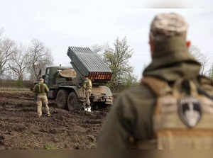 Artillerymen of the Ukrainian 80th separate airborne assault brigade prepare a BM-21 Grad multiple rocket launcher for fire towards Russian positions on the front line near Bakhmut in the Donetsk region, on April 18, 2023, amid the Russian invasion of Ukraine.  (Photo by Anatolii Stepanov / AFP)