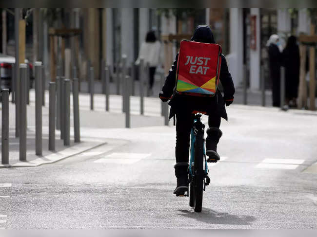 FILE PHOTO: A Just Eat delivery man rides his bicycle in Nice
