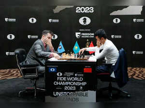 Grandmasters Ian Nepomniachtchi (L) from Russia and Ding Liren from China attend the first game of a 14-game match to decide who will be the new 17th World Chess Champion in Astana on April 9, 2023.  (Photo by AFP)