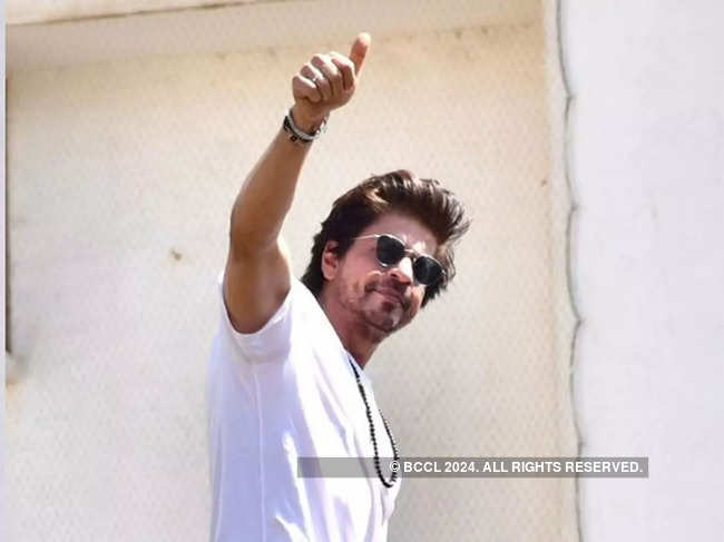 ​SRK kept it simple in a white T-shirt and a pair of blue denim trousers.