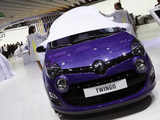 Models at the Renault exhibition booth unveil a new Renault Twingo