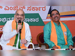 Hubballi_ Union Home Minister Amit Shah with Union Minister Pralhad Joshi addres____