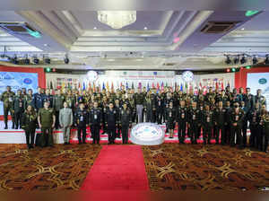 Military officials from 24 countries in the Indo-Pacific region pose for a photo...