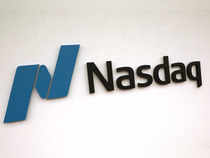 Nasdaq outperforms as investors cheer Microsoft, Dow transports sink