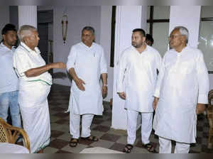 Patna: RJD Chief Lalu Prasad with Bihar Chief Minister Nitish Kumar at his resid...