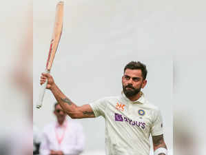 Ahmedabad : India's Virat Kohli raises his bat to acknowledge the crowd as he walks back to pavilion after his dismissal during the fourth day of the fourth cricket test match between India and Australia at Narendra Modi Stadium in Ahmedabad on Sunday, March 12, 2023.(Photo:Raj Kumar/IANS)