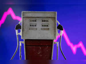 FILE PHOTO: Illustration shows model of petrol pump and decreasing stock graph
