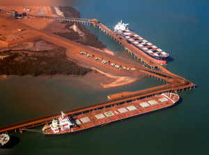 FILE PHOTO: Ships waiting to be loaded with iron ore are seen at the Fortescue loading dock located at Port Hedland