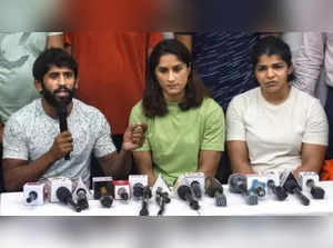 New Delhi: Wrestlers Bajrang Punia, Vinesh Phogat and Sakshi Malik speak to the media during their protest at Jantar Mantar, in New Delhi, on Tuesday, May 2, 2023. (Photo: Wasim Sarvar/IANS)