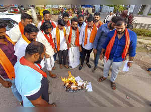 Udupi: Bajrang Dal workers burn copies of Karnataka Congress manifesto during a ...
