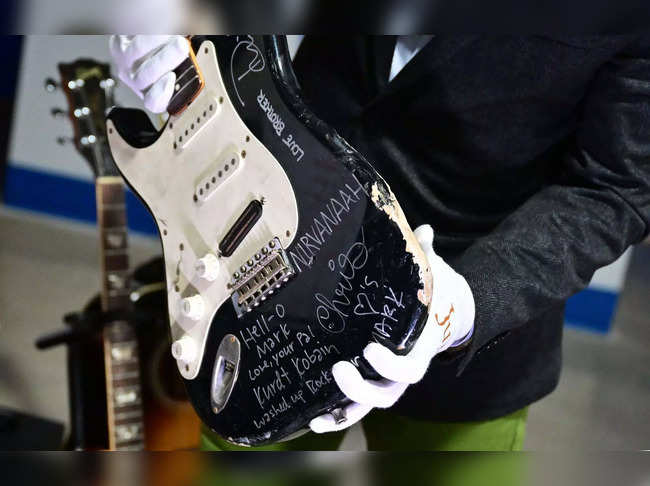 US musician Kurt Cobain's smashed Fender Stratocaster is dispalyed at Julien's Auctions in Gardena, California on May 2, 2023, ahead of Julien's "Music Icons" auction of over 1,200 items from Rock And Roll history and exclusive artist collections.  A guitar smashed up on stage by Nirvana front man Kurt Cobain is going under the hammer later this month in the United States. The guitar has been put back together, but is no longer playable, said Kody Frederick of Julien's Auctions, which expects the musical artifact to fetch $80,000. (Photo by Frederic J. BROWN / AFP)