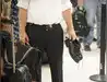 Image for US airports begin lifting shoe