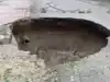 Image for Watch video: 15-foot-deep crater appears