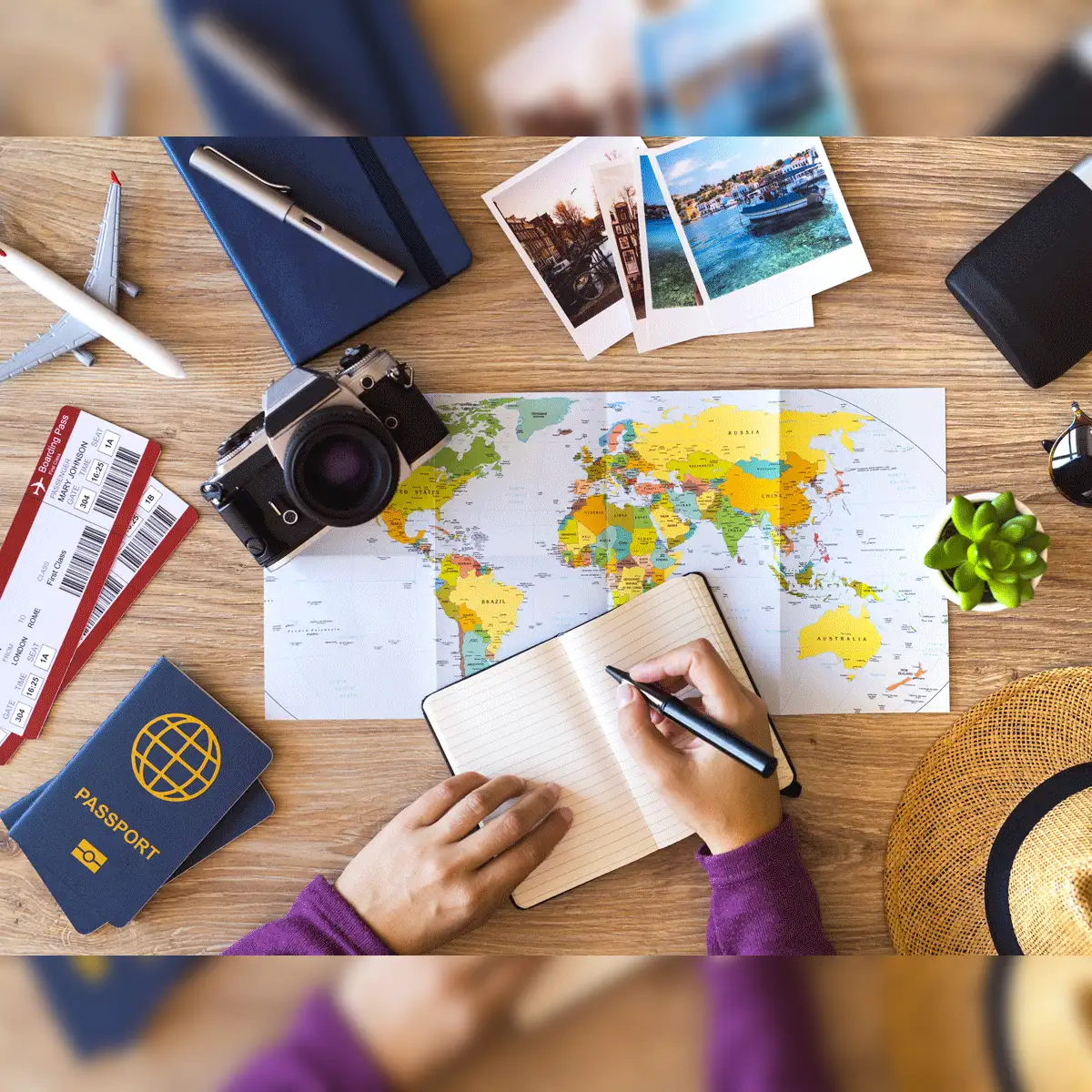 Travel planning with passport, map, notebook and travel documents