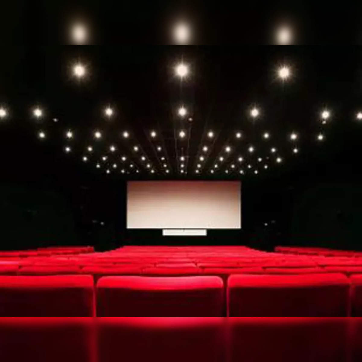Two Young Men Watching Movie in Theatre - Stock Photo - Masterfile -  Rights-Managed, Artist: Graham French, Code: 700-00086715