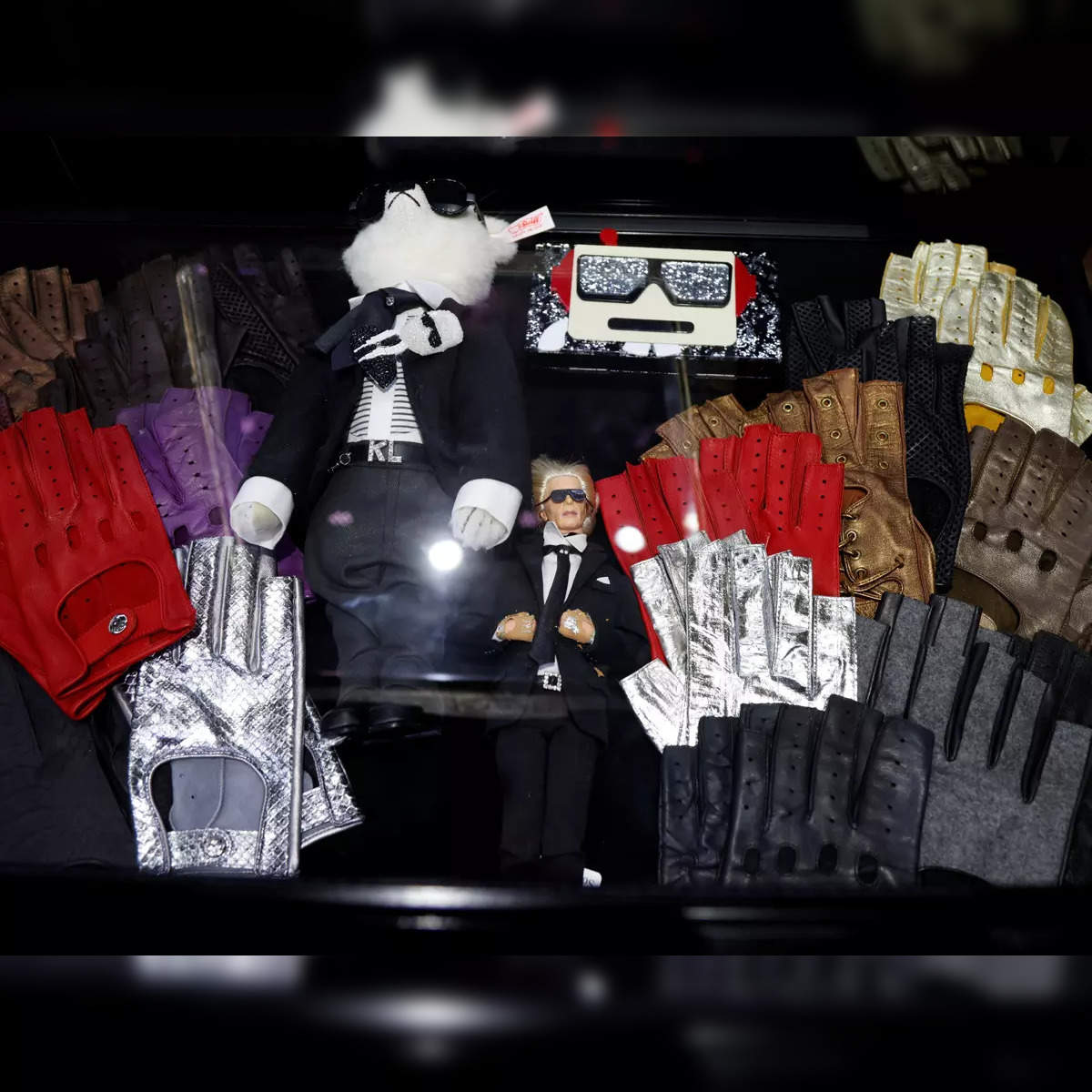 Karl Lagerfeld's five pairs of Chanel fingerless leather gloves fetch  $54.5K at Paris auction - The Economic Times