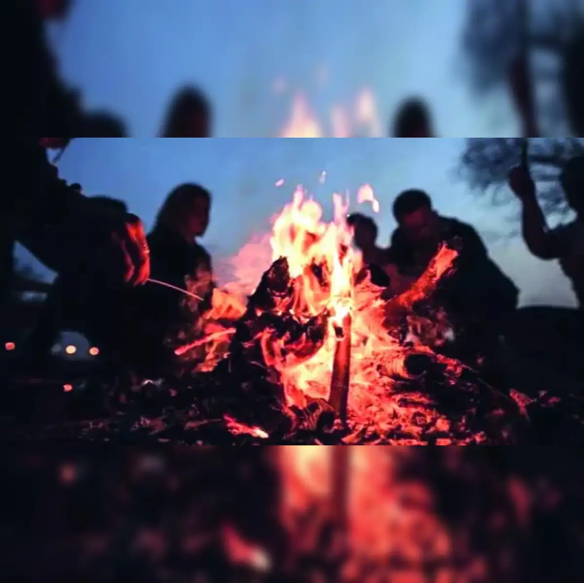 Sitting around a bonfire - The Economic Times