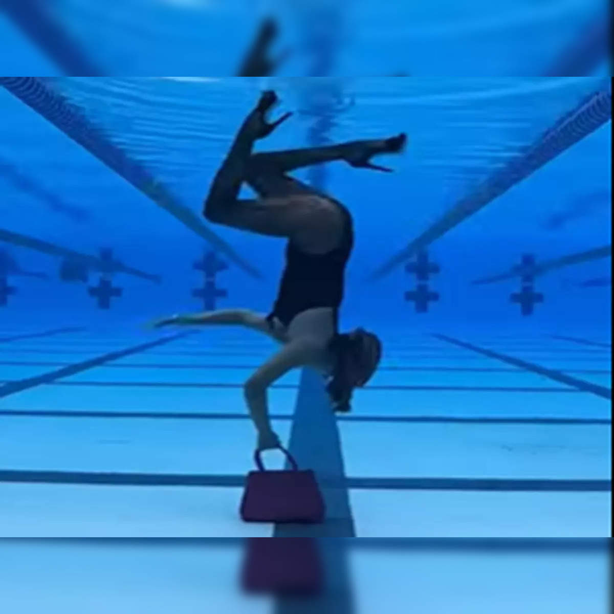 Viral video: Woman does a catwalk upside down under water - The Economic  Times