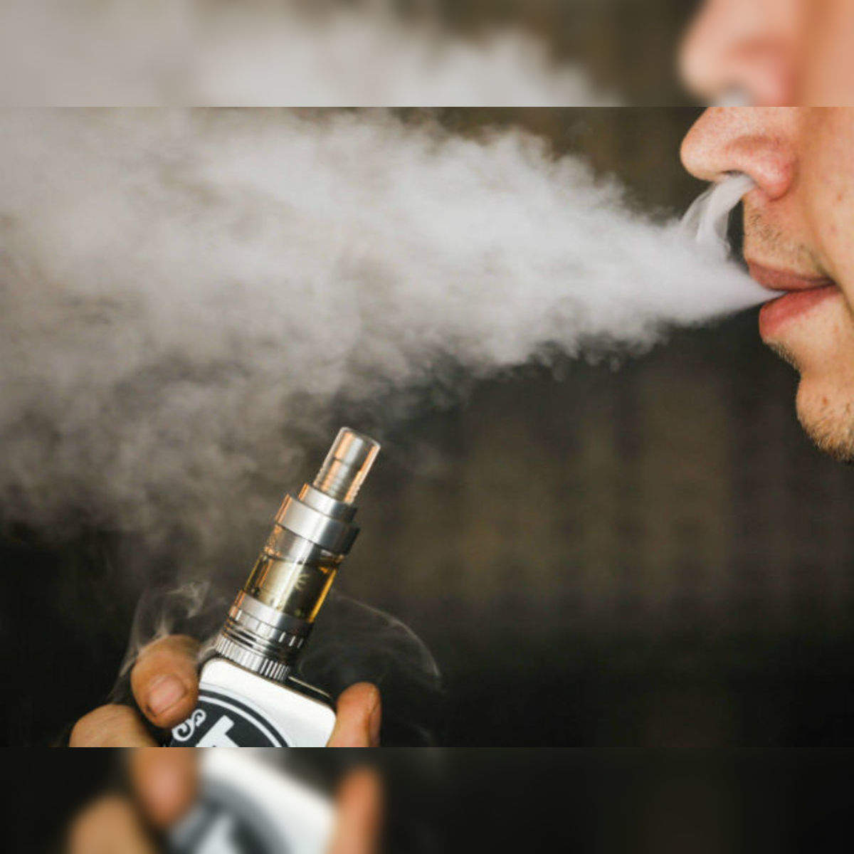 E cigarette vapour can kill lung cells Scientist The Economic Times