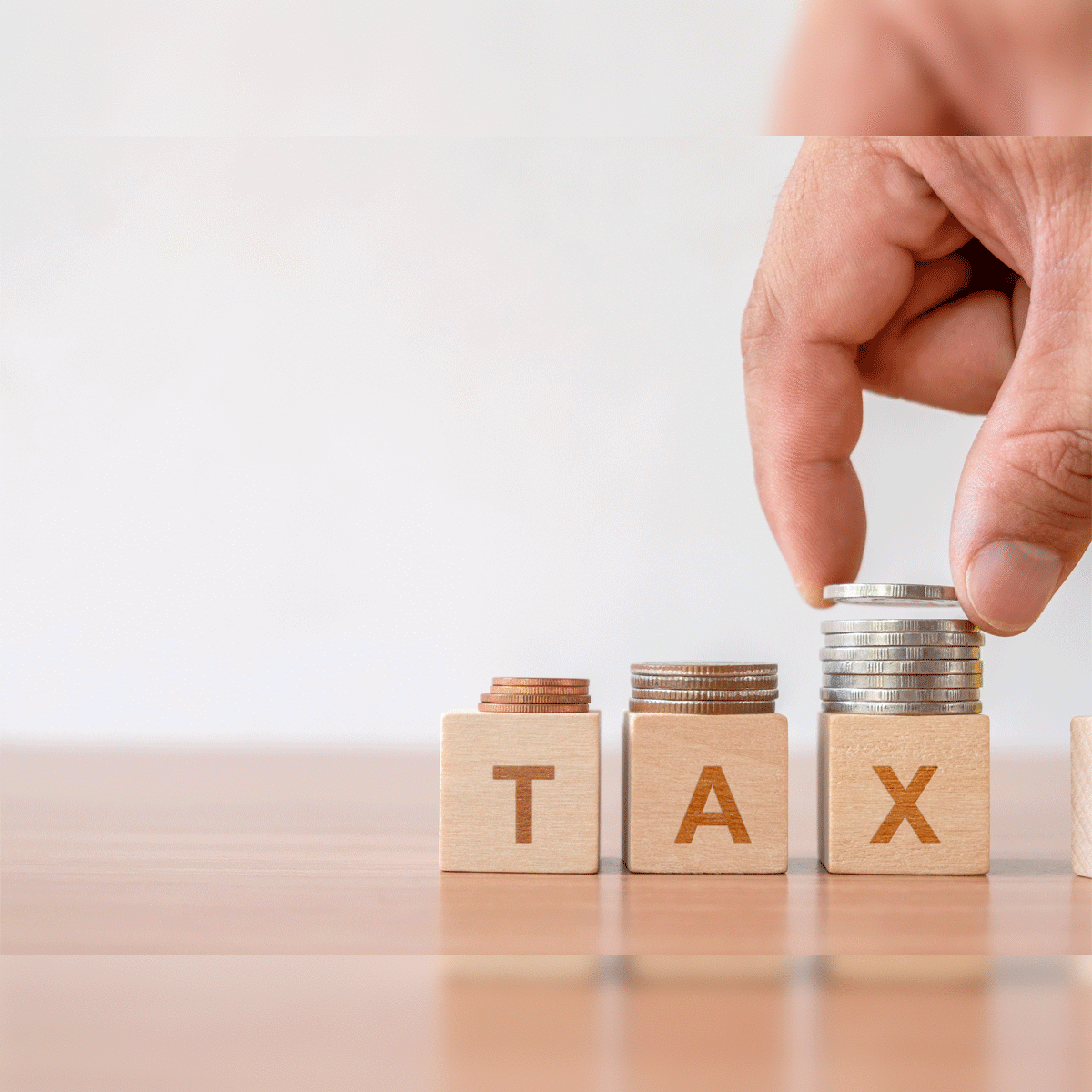 Who will pay capital gains tax if my wife transfers shares to me through  off-market transaction? - The Economic Times