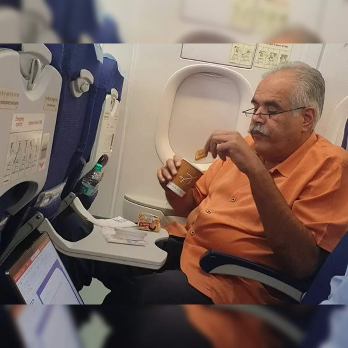 https://img.etimg.com/thumb/width-1200,height-1200,imgsize-45272,resizemode-75,msid-93139777/news/new-updates/rahul-bhatia-travels-economy-enjoys-tea-with-biscuits-pic-goes-viral.jpg