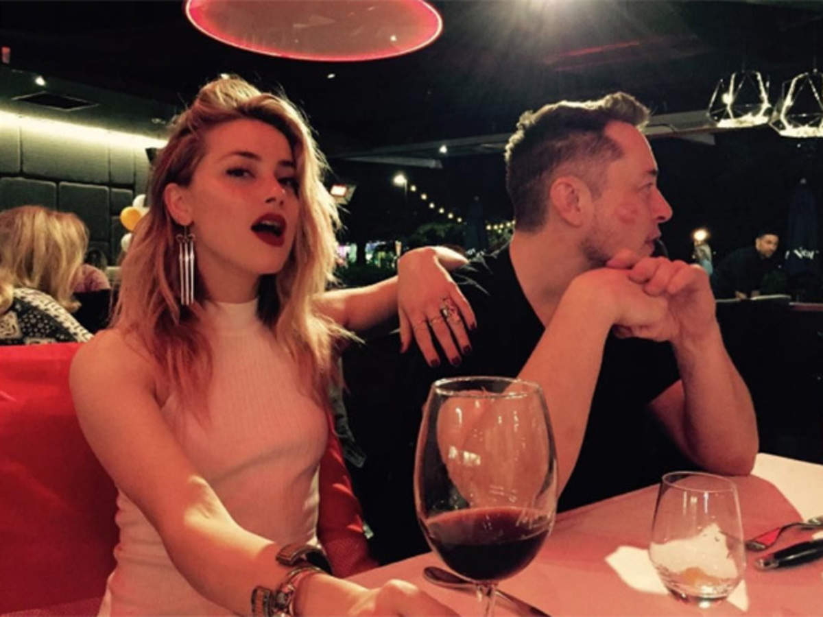 Amber Heard posted this picture with Elon Musk in 2017 and captioned it 'Cheeky' 