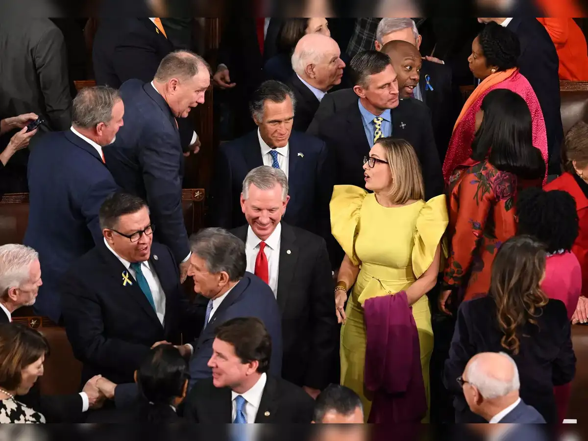 Kyrsten Sinema: Senator Kyrsten Sinema gets trolled on Twitter for wearing yellow  dress to State of the Union address - The Economic Times
