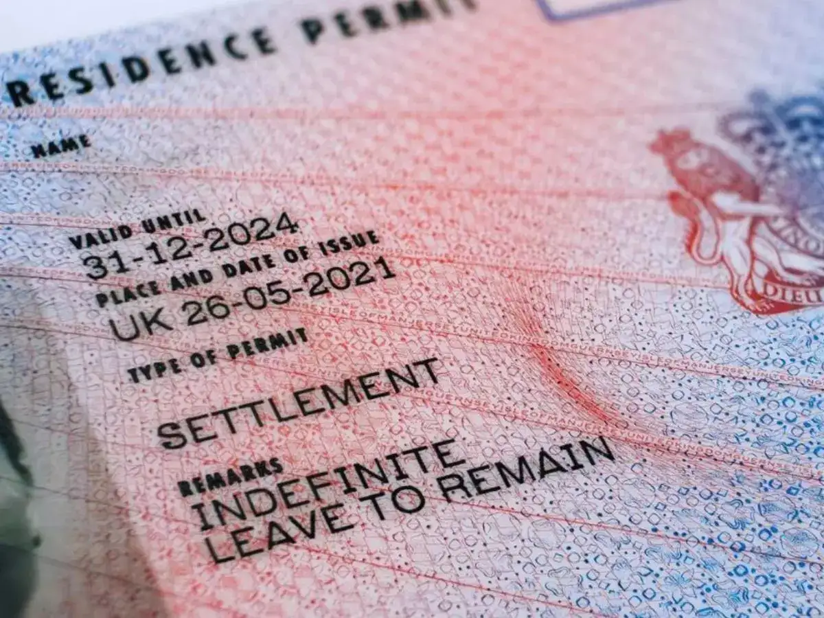 UK plans stricter rules for migrants seeking permanent residency