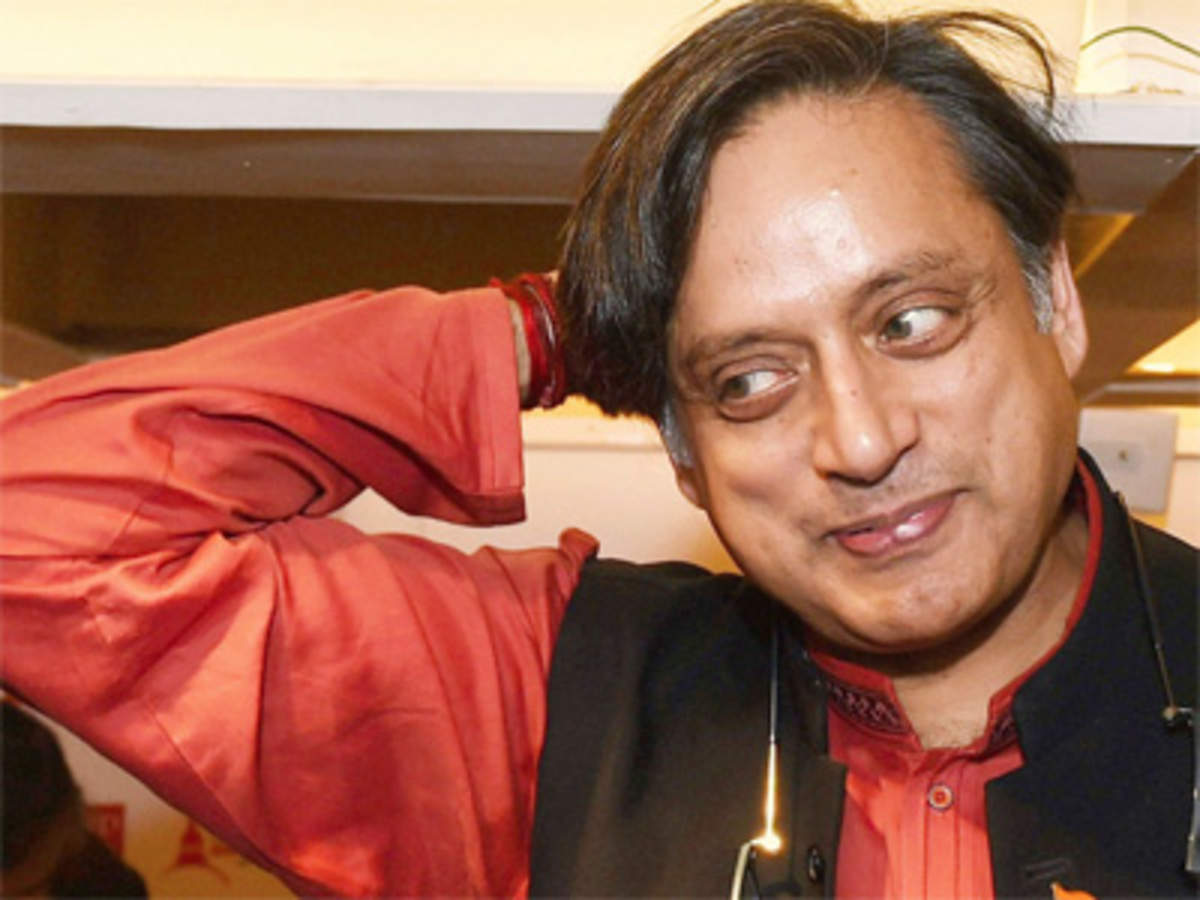 mahua moitra: Shashi Tharoor criticises circulation of his cropped image  with TMC MP Mahua Moitra, terms it 'cheap politics' - The Economic Times