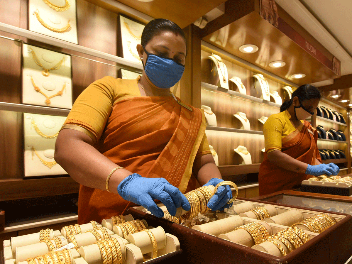 Gold prices scale fresh record high, top Rs 56,000 mark - The ...