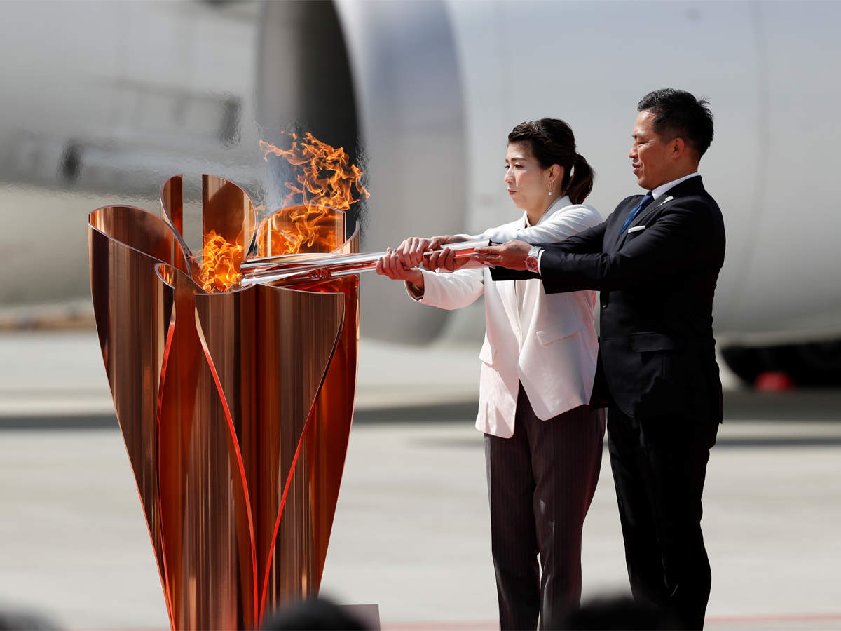 Coronavirus Olympic Flame Arrives In Japan Ahead Of Tokyo The Economic Times