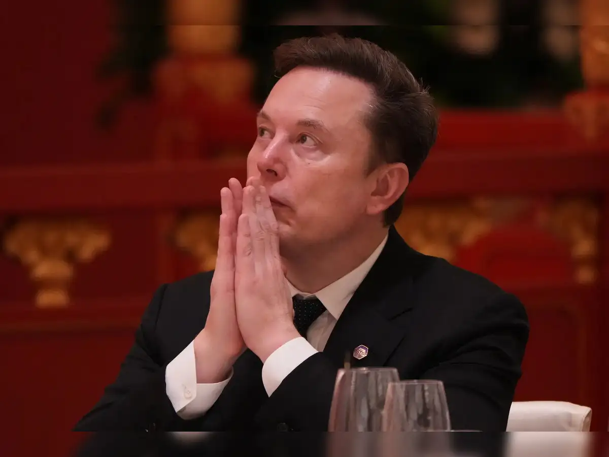 Elon Musk faces a mix of admiration and scrutiny during his China visit with US President Donald Trump; here's why