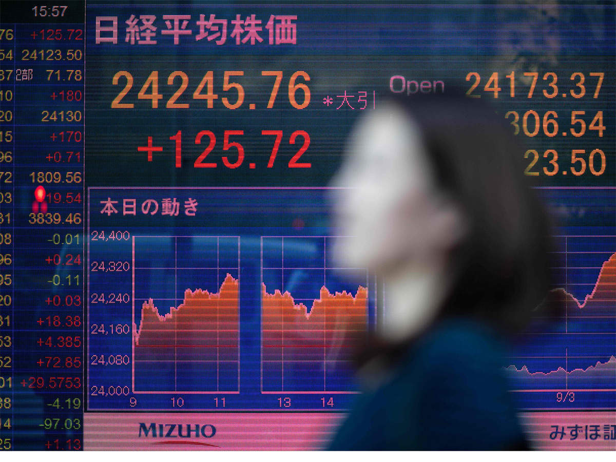 Japan Shares End Lower On Vaccine Delay Caution Ahead Of Earnings Season The Economic Times