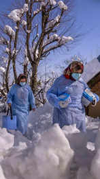 How vaccine workers in Kashmir brave the snow