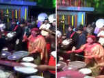 Maha CM's wife plays drum, welcomes him