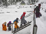 Kashmiri kids going to school through knee-deep snow