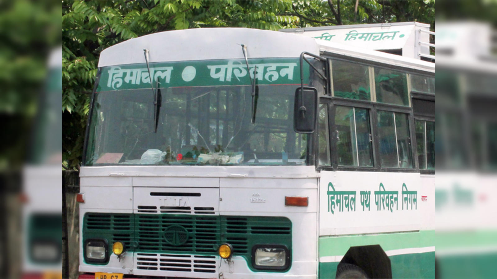 Tata 1510/1512 Bus on Dirt Road · Free Stock Photo